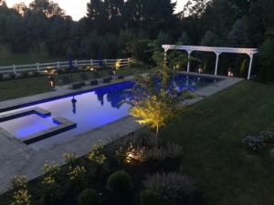 Long-custom-designed-pool-lit-for-the-evening Long custom designed pool lit for the evening